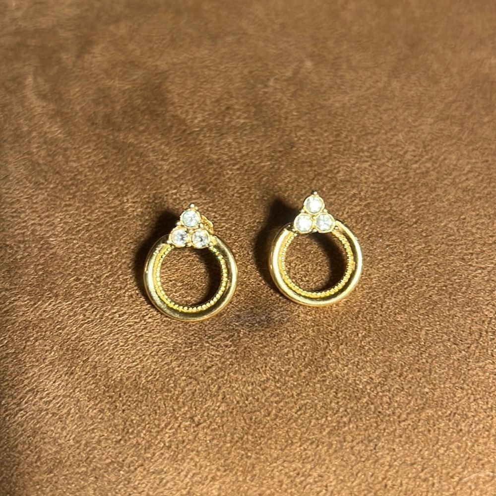 Faux gold/diamond pierced earrings.